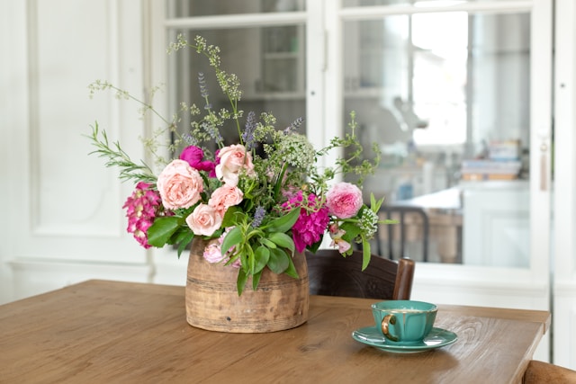 A thoughtful welcome basket with fresh flowers, snacks, and personal touches for Airbnb guests