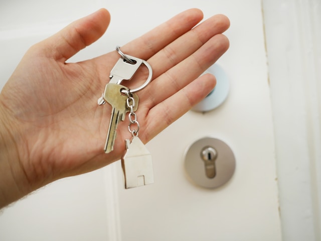 A welcoming home entrance with keys and welcome sign for Airbnb guests
